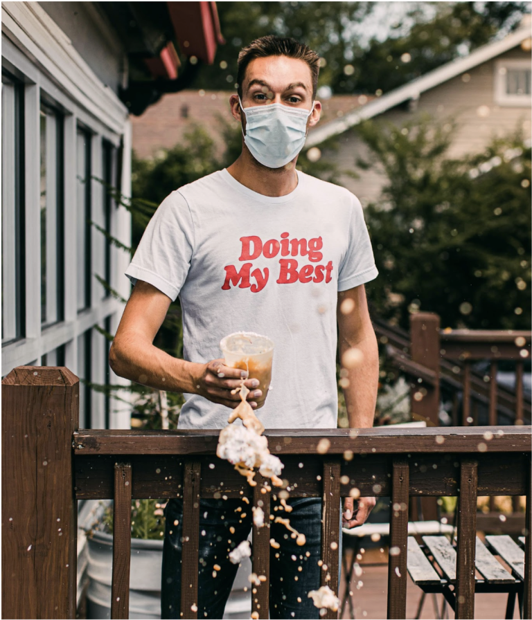 Image of a man with mask on and a shirt that says "doing my best", and spilled drops of coffee filling the frame. Image is representative of the DBT concept of radical acceptance of things you cannot change. Read this blog to learn about the benefits of radical acceptance.