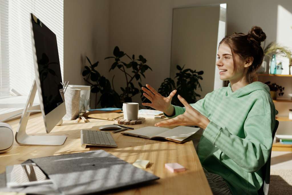 A photograph capturing a teenager engaging in online therapy from the comfort of their home.