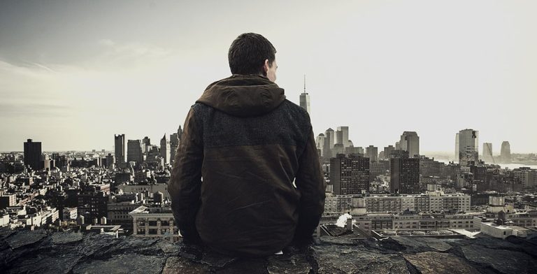 Suffolk DBT man looking over city on a cliff